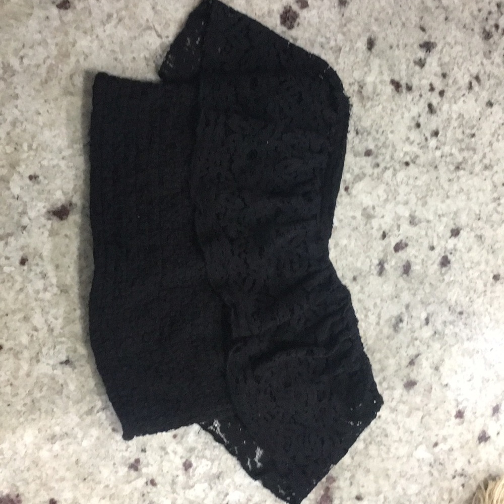 A black strapless stretchy crop top from hollister